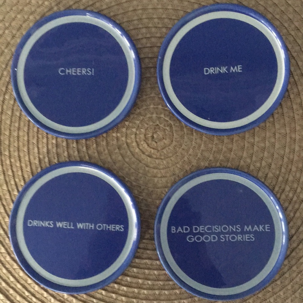 🌻 4 coasters with cork bottoms.
